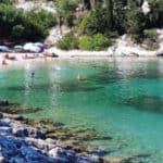 Foki Beach in Fiskardo with turquoise waters and surrounding greenery.