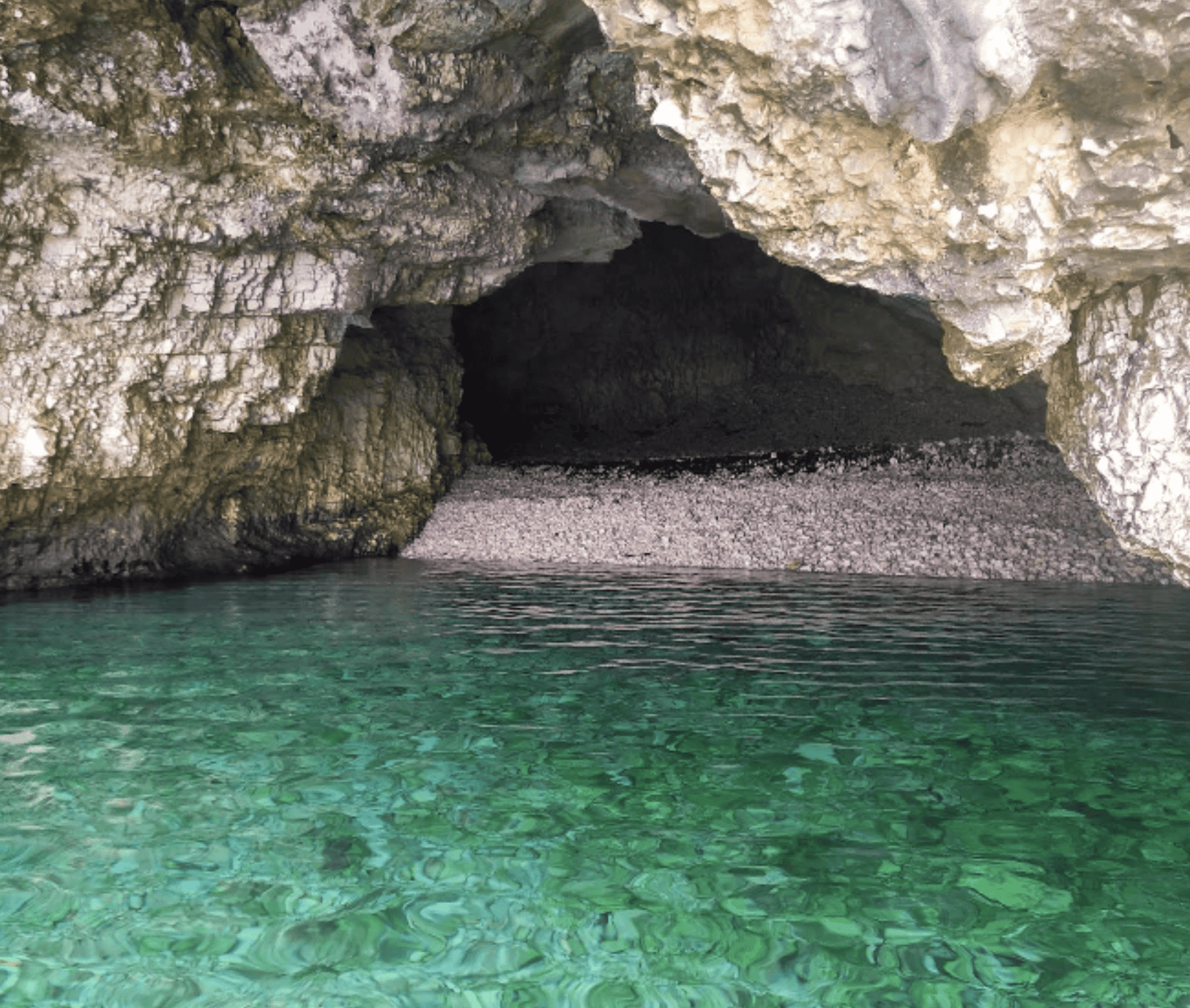 dafnoudi2 Sea cave at Dafnoudi Beach with clear turquoise water.